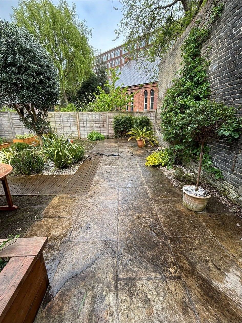 Patio half cleaned showing the difference